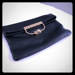 Leather Clutch with gold clasp. Great for Travel!